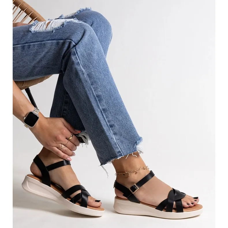 Khalid's black low wedge sandals