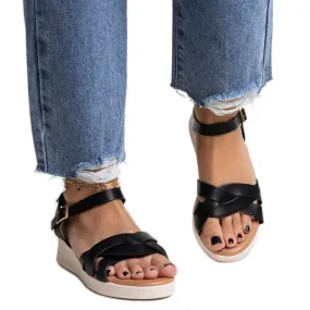 Khalid's black low wedge sandals