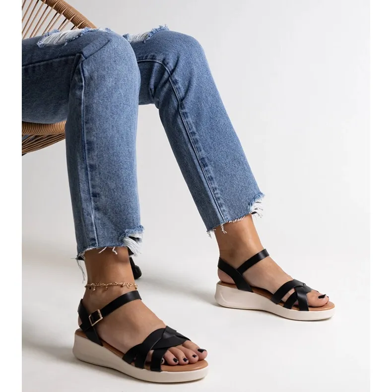 Khalid's black low wedge sandals