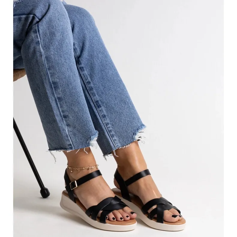 Khalid's black low wedge sandals